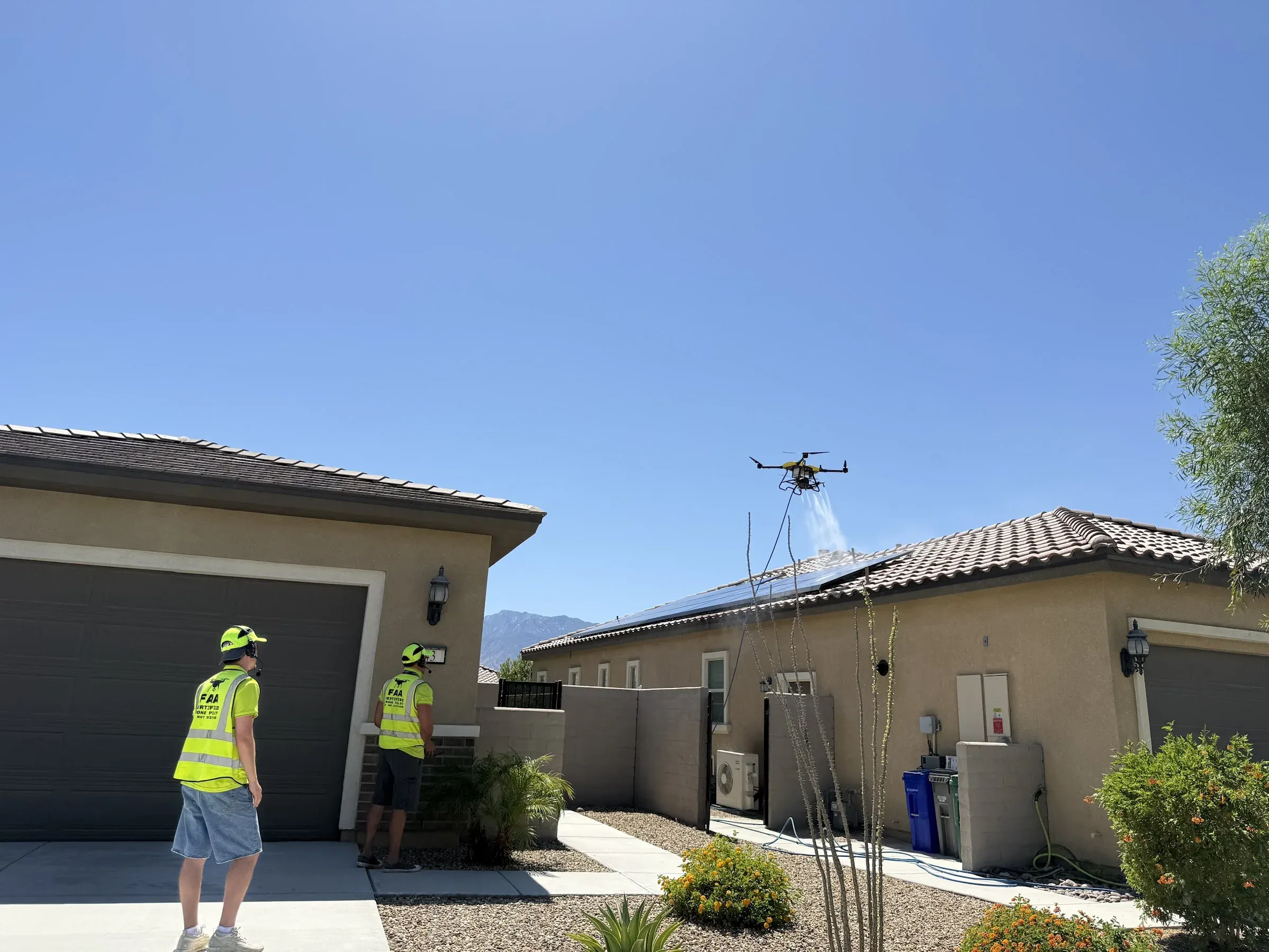 DronePower1 FAA-licensed crew operating a purpose-built cleaning drone over a residential solar array