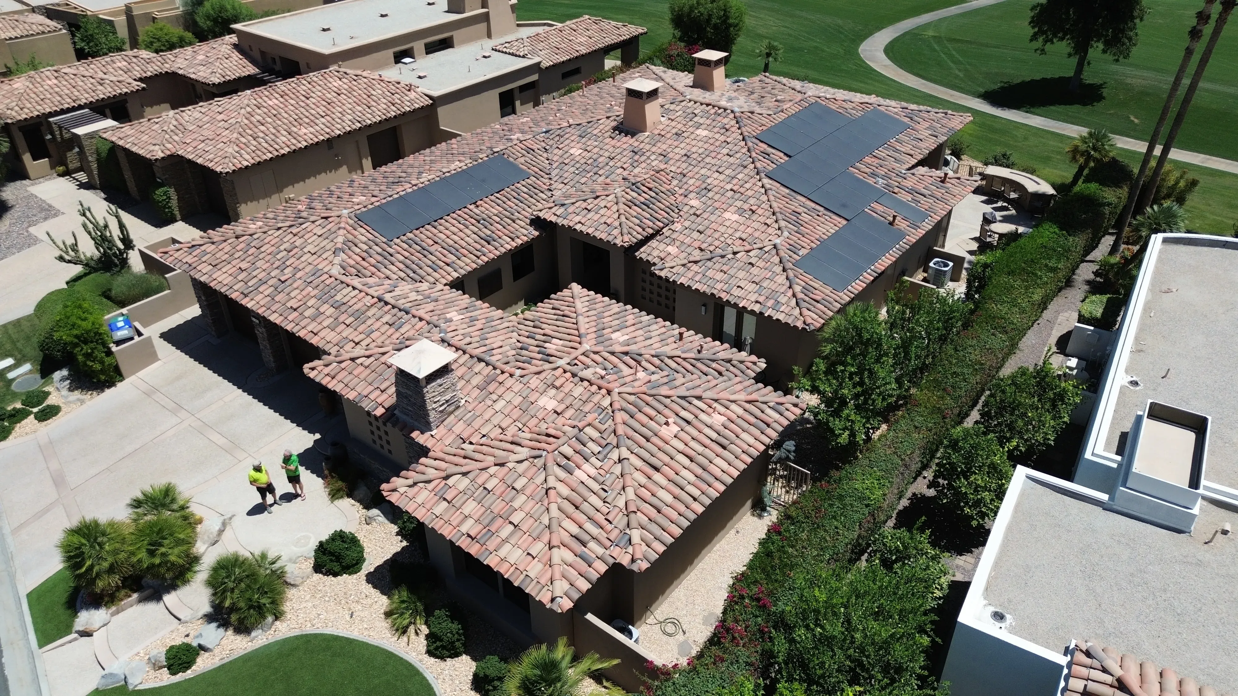 Aerial roof shot with surrounding property and landscape visible
